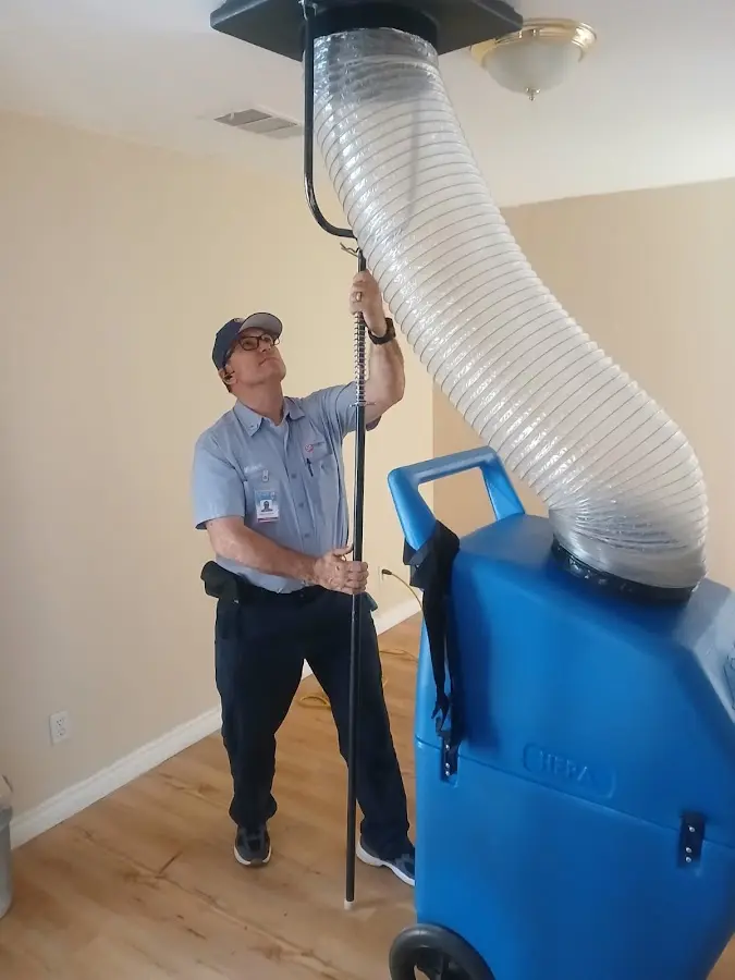 Furnace Tune-Up technician using HEPA equipment in South El Monte